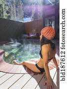 Woman relaxing in hot tub