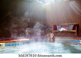 Woman relaxing in hot tub