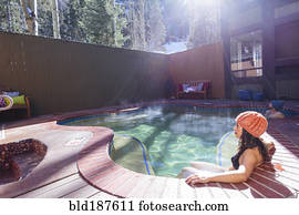 Woman relaxing in hot tub