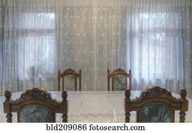 Carved wooden chairs at table in dining room