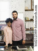 Couple smiling in home office