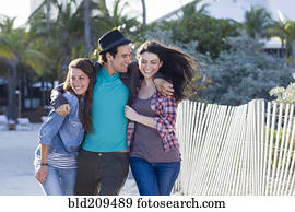 Friends walking on beach