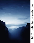 Illuminated mist and mountains