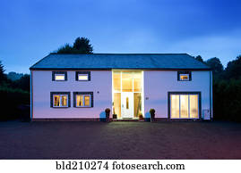 Modern house illuminated at twilight