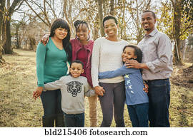 Black family smiling outdoors