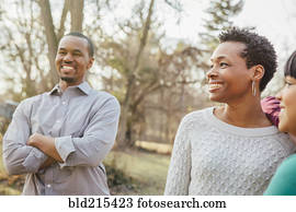 Black family smiling outdoors