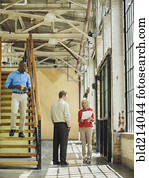 Business people talking in warehouse