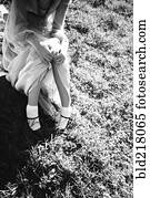 High angle view of woman sitting in grass