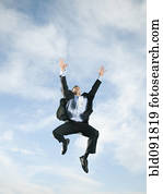 Caucasian businessman jumping in air