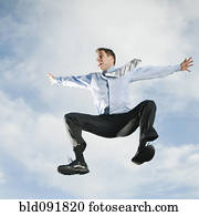 Caucasian businessman jumping in air