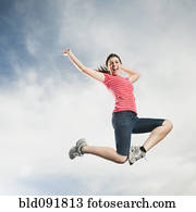 Caucasian teenager jumping in air