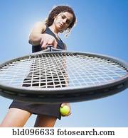 Caucasian woman playing tennis