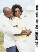 African American couple hugging