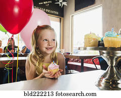 Caucasian girl celebrating birthday in cafe