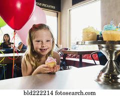 Caucasian girl celebrating birthday in cafe