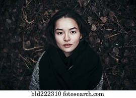 Caucasian woman laying in dirt