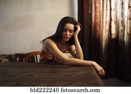 Caucasian woman sitting at table