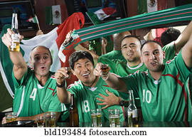 Cheering men drinking in sports bar