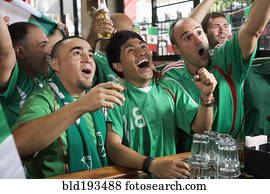 Cheering men watching television in sports bar