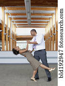 Couple dancing in empty office space