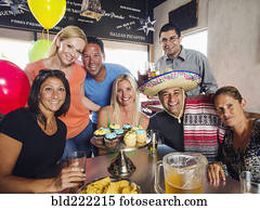 Friends celebrating birthday in cafe