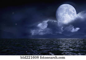 Full moon over seascape and horizon