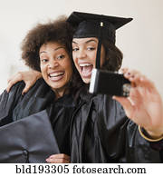 Graduating friends taking self-portrait