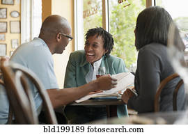 African American co-workers working in restaurant