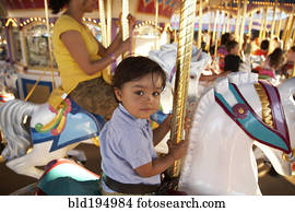Mother and son on merry-go-round