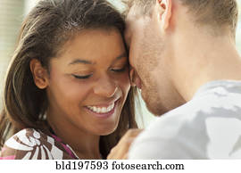 Smiling couple hugging outdoors Smiling couple hugging outdoors