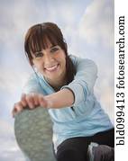 Caucasian woman stretching before exercise