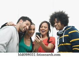 Friends looking at cell phone