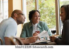 African American co-workers working in restaurant