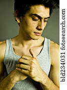 Pensive Mixed Race man wearing tank-top