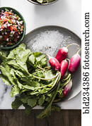 Plate of radishes with sea salt and pico de gallo