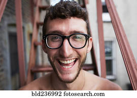 Portrait of Caucasian man on urban fire escape