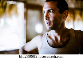 Serious man wearing tank-top