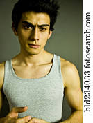 Serious Mixed Race man wearing tank-top