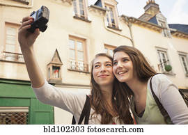 Caucasian friends taking self-portrait
