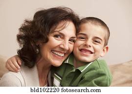 Caucasian grandmother hugging grandson