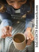 Cape Verdean woman drinking coffee