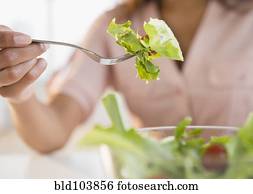 Cape Verdean woman eating salad