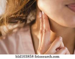 Cape Verdean woman feeling her pulse