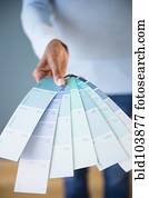 Cape Verdean woman holding color swatches