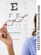 Cape Verdean woman holding eyeglasses