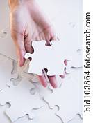 Cape Verdean woman holding puzzle piece