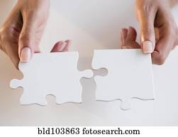 Cape Verdean woman holding puzzle pieces