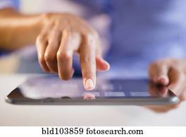 Cape Verdean woman using digital tablet