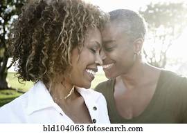 Smiling African American mother and daughter