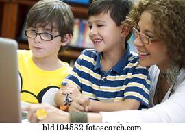 Hispanic teacher helping students